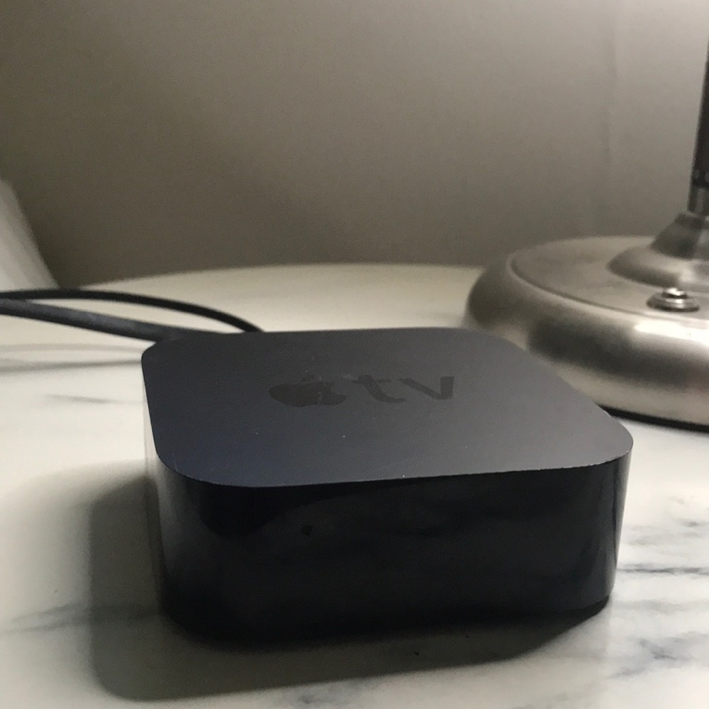 Apple TV console with hdmi cable